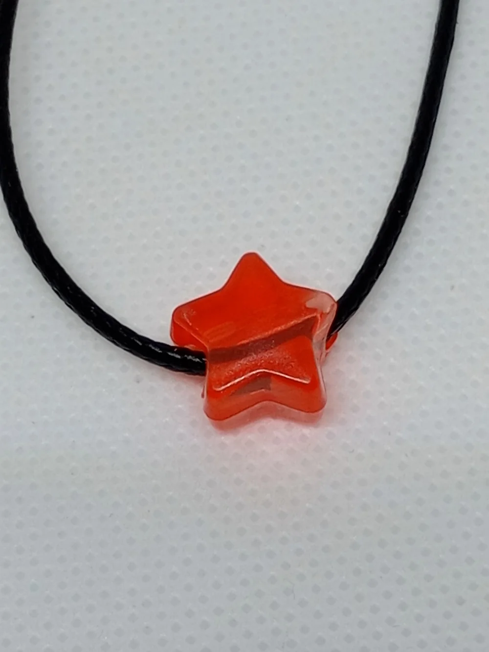 Orange Star Pendant Necklace on Black Cord